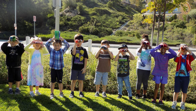 kids with craft binoculars